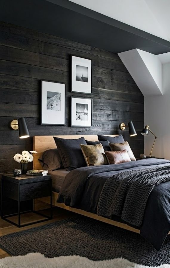 Modern dark bedroom with wooden accent wall ideal for short term rental management